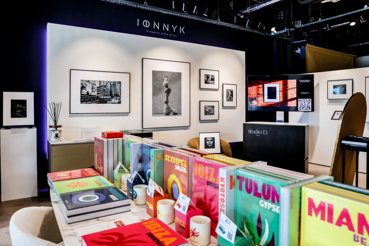 IONNYK digital art frames displaying black and white photography in a design store in Luxembourg